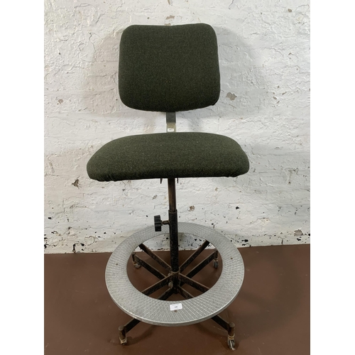 146 - A mid 20th century Tan-Sad green fabric upholstered and steel industrial factory adjustable swivel d... 