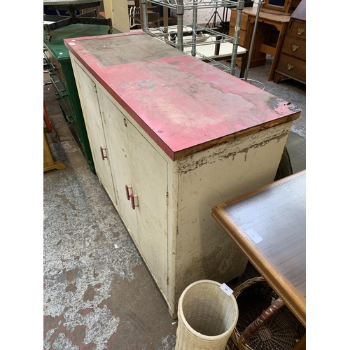 149 - A 1950s red laminate and white painted three door kitchen cabinet - approx. 92cm high x 109cm wide x... 