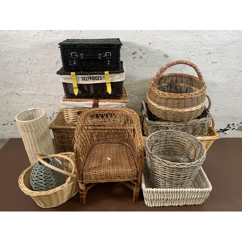 150 - Fourteen pieces of wicker furniture to include baskets, child's chair etc.