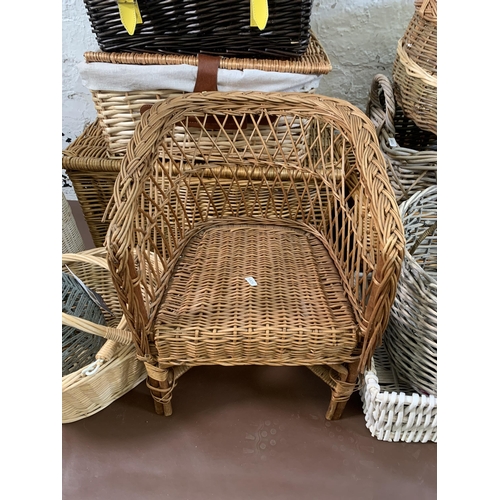 150 - Fourteen pieces of wicker furniture to include baskets, child's chair etc.