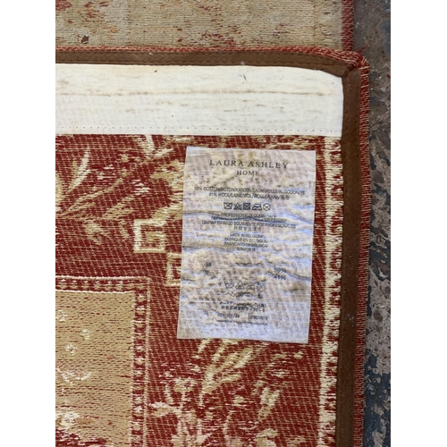 153 - A Laura Ashley Home cotton and wool rug - approx. 167cm x 116cm