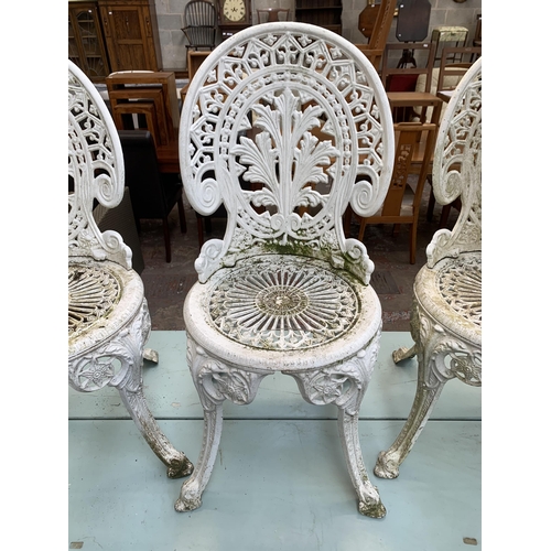 160A - Four Victorian style white painted cast metal patio chairs