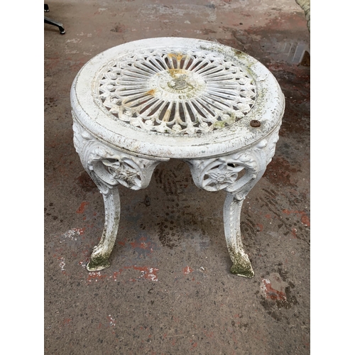 160A - Four Victorian style white painted cast metal patio chairs