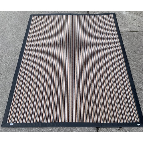 163 - A modern black leatherette and striped rug - approx. 225cm x 160cm