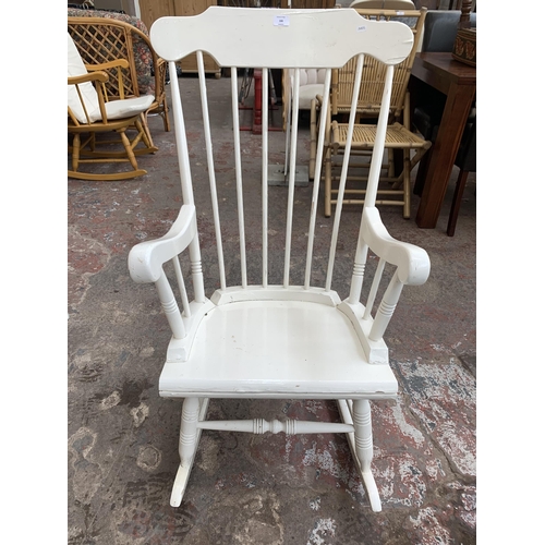 166 - A white painted spindle back farmhouse rocking chair