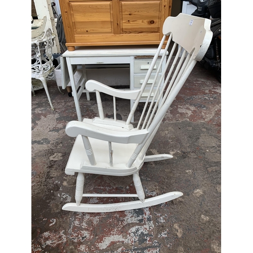 166 - A white painted spindle back farmhouse rocking chair