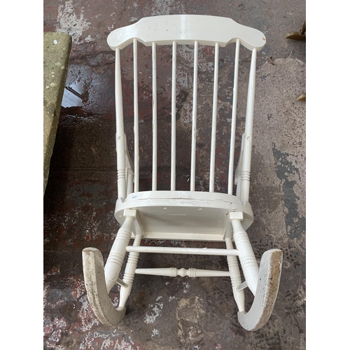 166 - A white painted spindle back farmhouse rocking chair