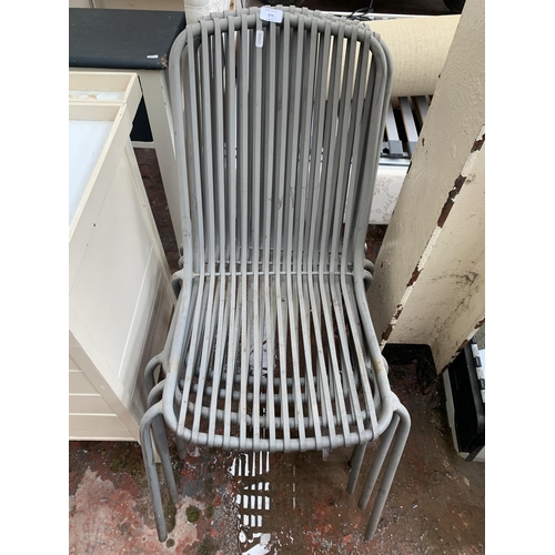 170 - Four grey metal stacking patio chairs