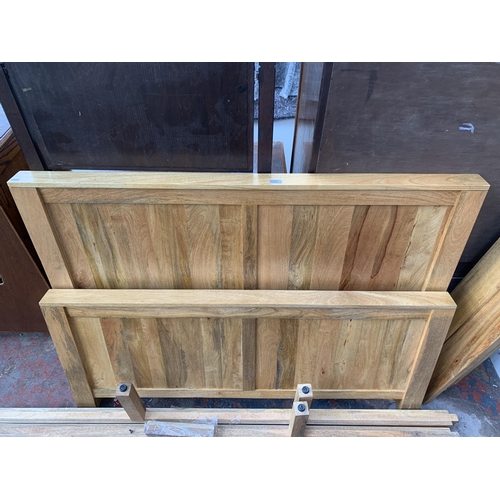 172 - A mango wood double bed frame - approx. 146cm wide