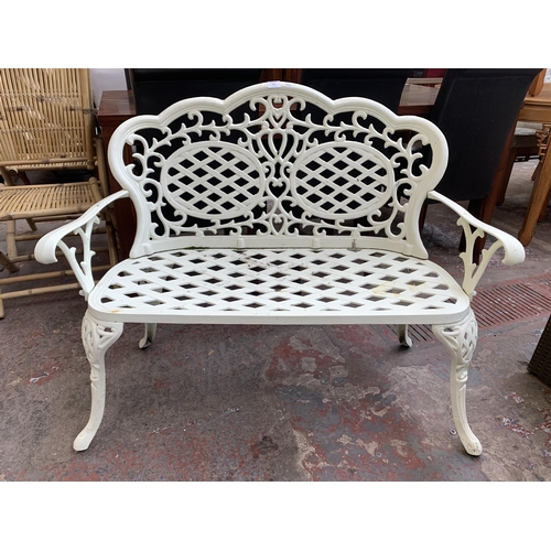 173 - A Victorian style white painted cast metal two seater garden bench - approx. 89cm high x 108cm wide ... 