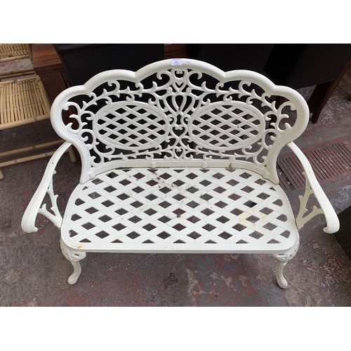 173 - A Victorian style white painted cast metal two seater garden bench - approx. 89cm high x 108cm wide ... 