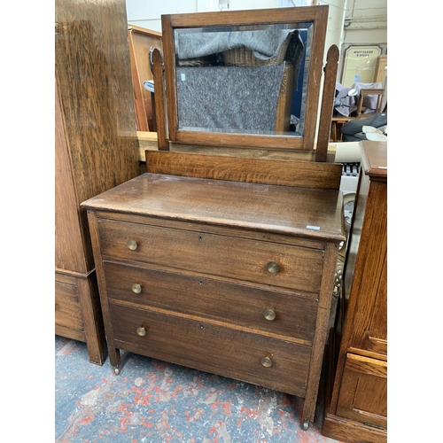 178 - An early 20th century oak dressing chest with upper bevelled edge mirror - approx. 149cm high x 93cm... 