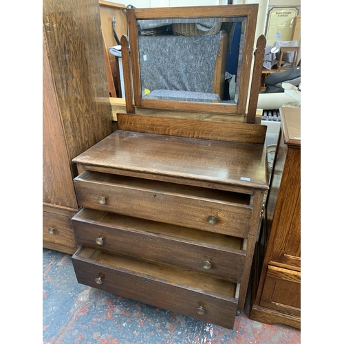 178 - An early 20th century oak dressing chest with upper bevelled edge mirror - approx. 149cm high x 93cm... 