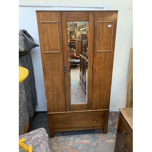 179 - An early 20th century oak mirror door wardrobe - approx. 185cm high x 95cm wide x 47cm deep