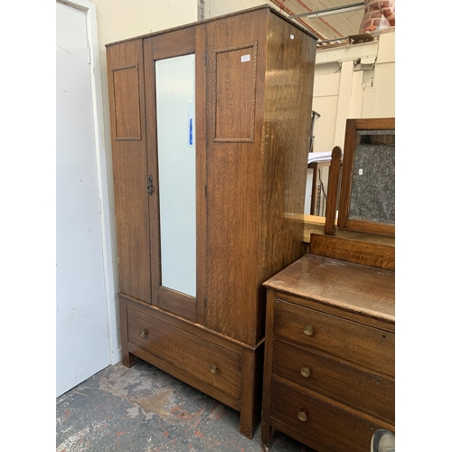 179 - An early 20th century oak mirror door wardrobe - approx. 185cm high x 95cm wide x 47cm deep