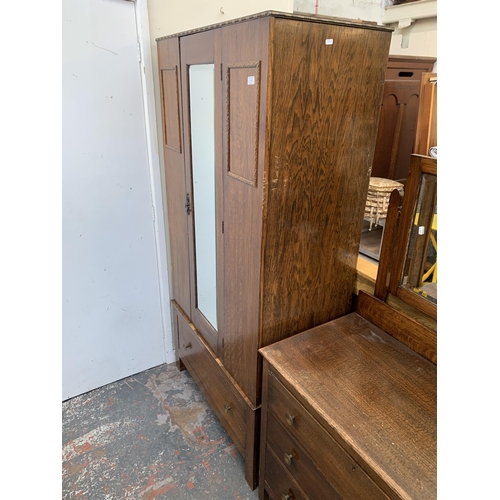 179 - An early 20th century oak mirror door wardrobe - approx. 185cm high x 95cm wide x 47cm deep