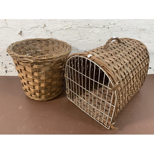 180 - Two pieces of wicker furniture, one basket and one cat basket