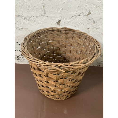 180 - Two pieces of wicker furniture, one basket and one cat basket