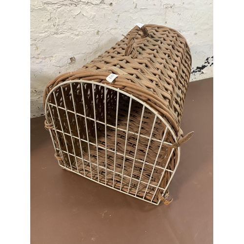 180 - Two pieces of wicker furniture, one basket and one cat basket