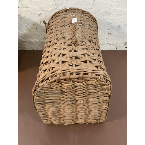 180 - Two pieces of wicker furniture, one basket and one cat basket