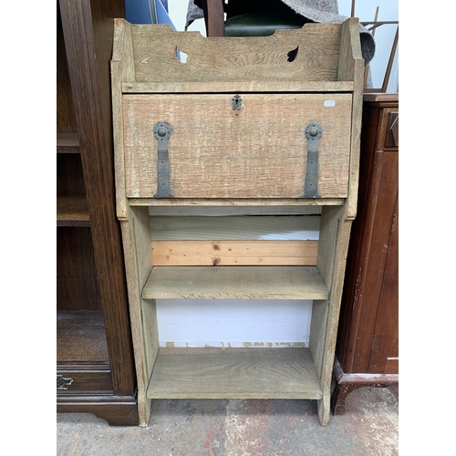 183 - An Arts & Crafts carved oak bureau bookcase - approx. 117cm high x 61cm wide x 25cm deep