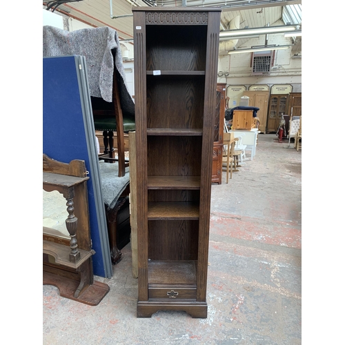 184 - An oak five tier bookcase - approx. 182cm high x 44cm wide x 30cm deep