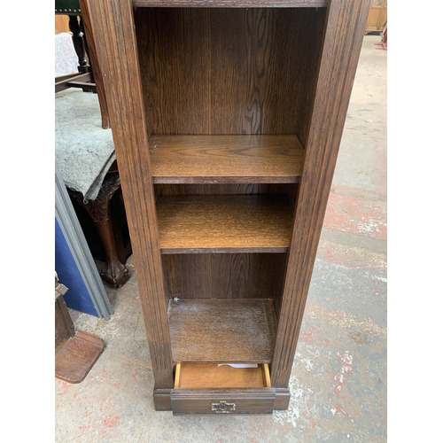 184 - An oak five tier bookcase - approx. 182cm high x 44cm wide x 30cm deep