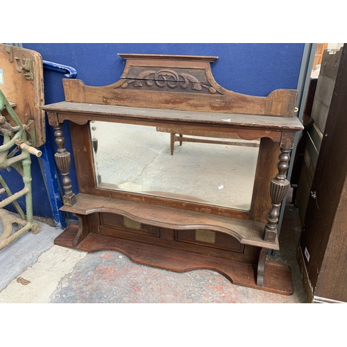 185 - A Victorian carved mahogany over mantle mirror with two brass plaques - approx. 114cm high x 120cm w... 