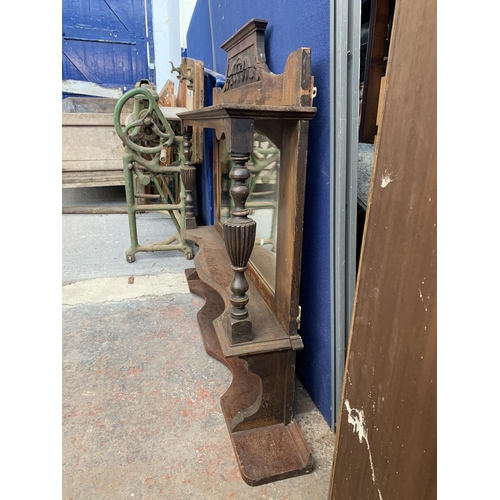 185 - A Victorian carved mahogany over mantle mirror with two brass plaques - approx. 114cm high x 120cm w... 