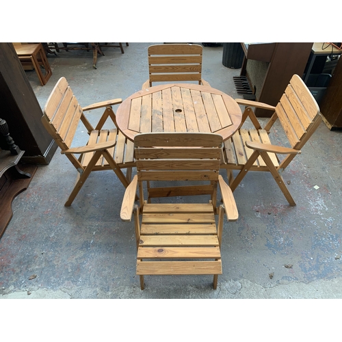 188 - A pine five piece patio set comprising circular table and four chairs - table approx. 73cm high x 91... 