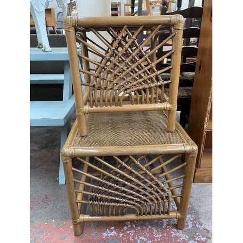 191 - Two Boho style cane and wicker side tables - largest approx. 46cm high x 52cm wide x 67cm long