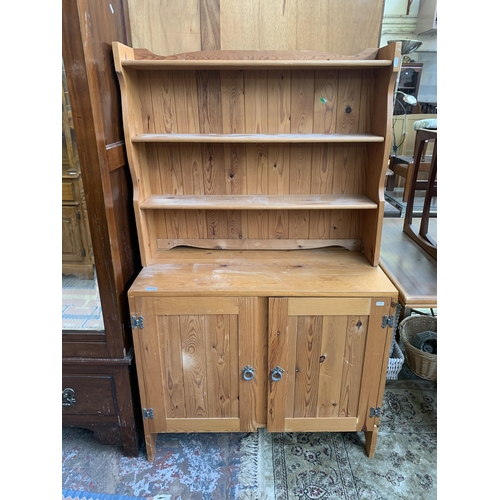 196 - A pine dresser with upper plate rack - approx. 155cm high x 90cm wide x 42cm deep