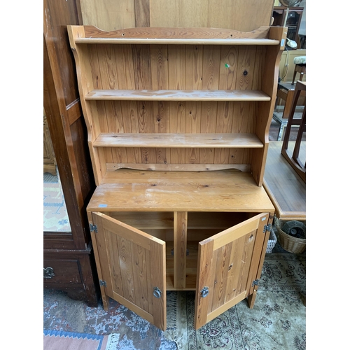 196 - A pine dresser with upper plate rack - approx. 155cm high x 90cm wide x 42cm deep