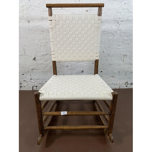 198 - An early 20th century oak and white cotton rocking chair - approx. 89cm high x 49cm wide x 65cm deep