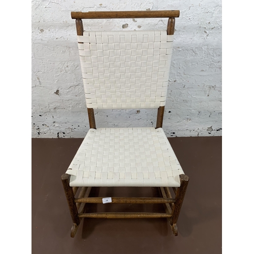 198 - An early 20th century oak and white cotton rocking chair - approx. 89cm high x 49cm wide x 65cm deep