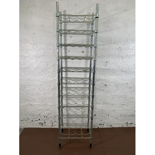 201 - A metal forty four section free standing bottle rack - approx. 180cm high x 46cm wide x 36cm deep