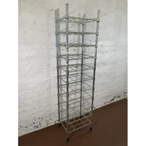 201 - A metal forty four section free standing bottle rack - approx. 180cm high x 46cm wide x 36cm deep