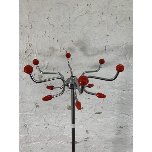 202 - A mid 20th century metal and red plastic coated Sputnik coat stand - approx. 163cm high