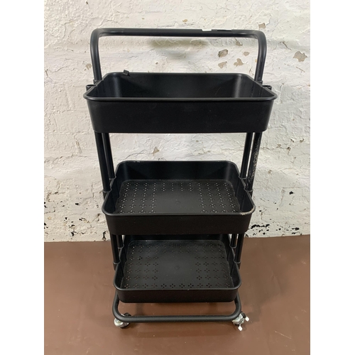 209 - A modern black metal and plastic three tier trolley - approx. 85cm high x 42cm wide x 33cm deep