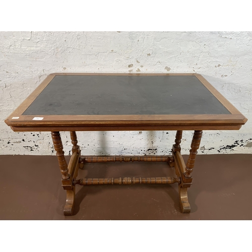 215 - A Victorian mahogany writing table with black leather insert - approx. 74cm high x 99cm wide x 61cm ... 