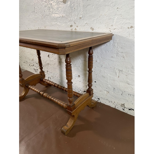 215 - A Victorian mahogany writing table with black leather insert - approx. 74cm high x 99cm wide x 61cm ... 