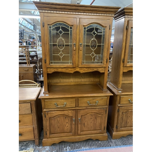 220 - An oak dresser - approx. 200cm high x 106cm wide x 46cm deep