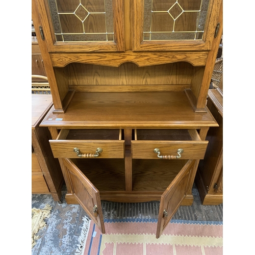 220 - An oak dresser - approx. 200cm high x 106cm wide x 46cm deep