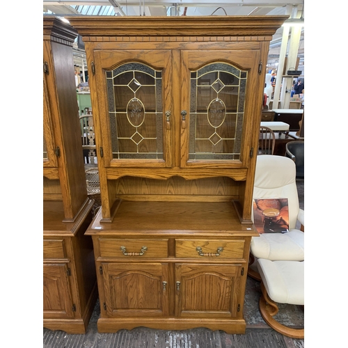 221 - An oak dresser - approx. 200cm high x 106cm wide x 46cm deep