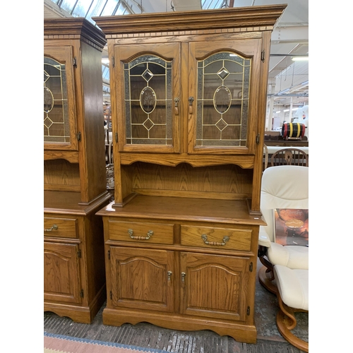 221 - An oak dresser - approx. 200cm high x 106cm wide x 46cm deep