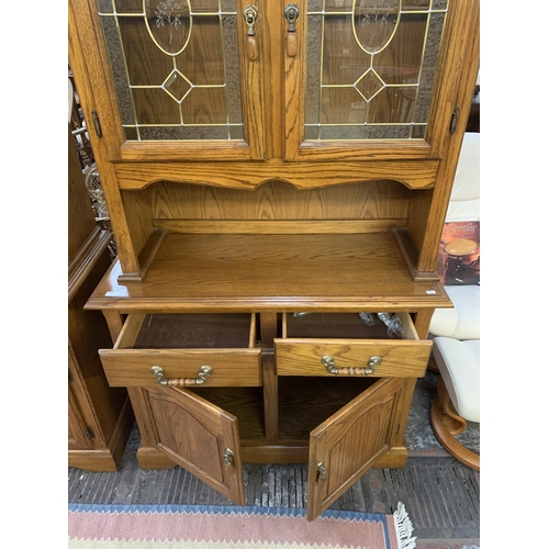 221 - An oak dresser - approx. 200cm high x 106cm wide x 46cm deep