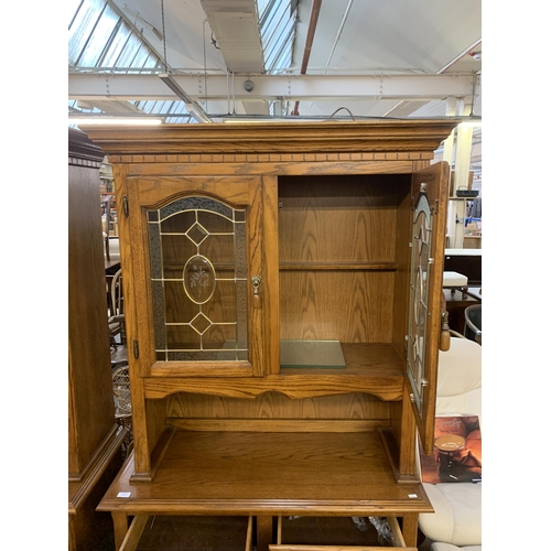 221 - An oak dresser - approx. 200cm high x 106cm wide x 46cm deep