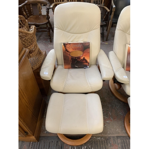 223 - An Ekornes Stressless cream leather and bentwood swivel reclining armchair and footstool with boxed ... 