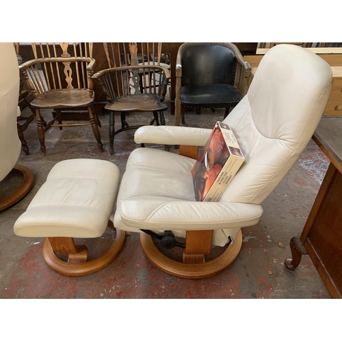 224 - An Ekornes Stressless cream leather and bentwood swivel reclining armchair and footstool with boxed ... 