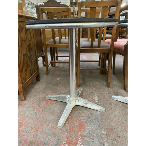 228 - A pair of metal and wooden top circular bistro tables - approx. 70cm high x 60cm diameter